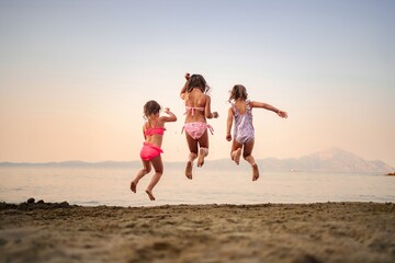 Joyful family adventure at the beach during sunset playtime