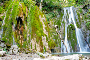 Scenic view of the twin waterfalls in Faedis, located in the forested hills of northeastern Italy....