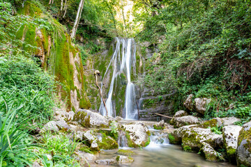 Scenic view of the twin waterfalls in Faedis, located in the forested hills of northeastern Italy....