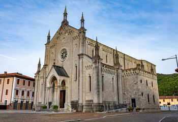 Fototapeta premium A traditional Catholic church in the village of Faedis, northeastern Italy, featuring a stone facade, bell tower, and peaceful surroundings. Perfect example of rural Italian religious architecture.