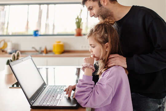 Parent and child browsing online grocery shopping