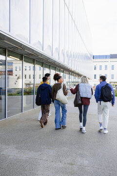A group of young people walking through the city