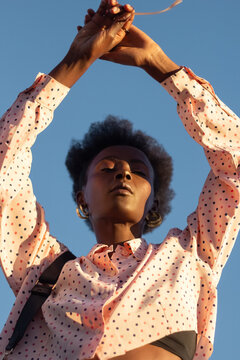 Beautiful woman posing against blue sky