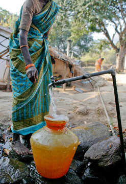 Woman collecting water
