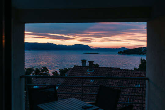 A sunrise seen through an apartment window 