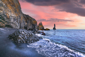 Impressive landscape with basalt rock formations Troll Toes on Black beach Reynisfjara near the...