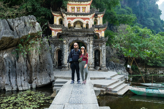 Couple Standing in Front of Historic Pagoda in Ninh Binh
