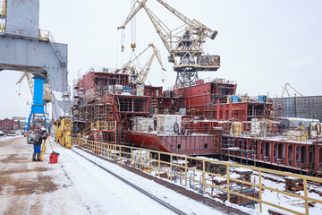 The process of completing the construction of a large icebreaker.