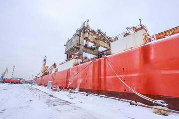 The process of completing the construction of a large icebreaker.