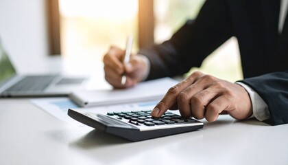 close up of a businessman holding a calculator