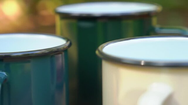 Enamel Mugs on Table