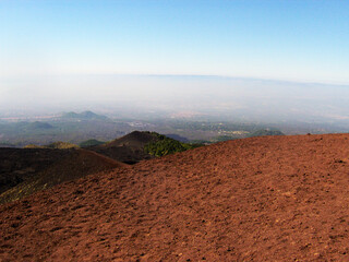 Breathtaking view of Mount Etna's volcanic landscape in Sicily, where the rugged terrain is...