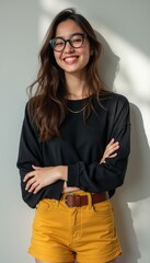 Confident young woman smiling with arms crossed