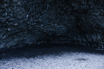 Basalt Rock Cave with Snow-Covered Ground