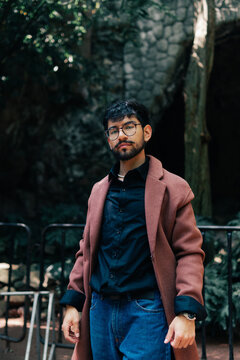 Young man looking at camera with natural pose.