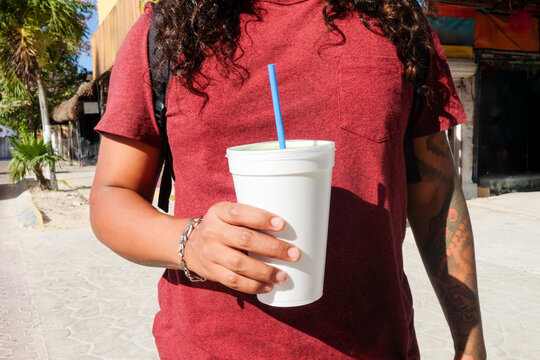 Cropped View of Man Holding Large Smoothie