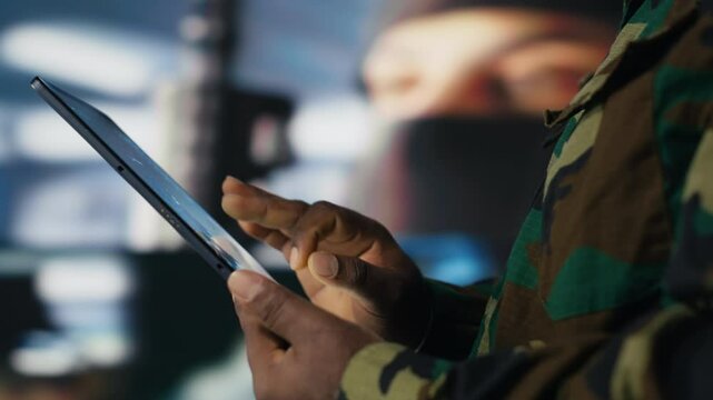 African american army staff monitoring drone and satellite imagery to collect information, finding enemy position helpful for war planning. National defense mission operations. Camera B.