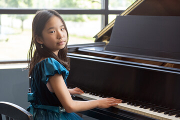 Portrait of a Young Pianist in A Blue Dress