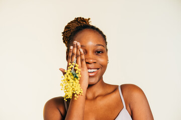 Smiling Woman Holding Mimosa Flowers