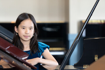 Portrait of a Young Pianist in A Blue Dress