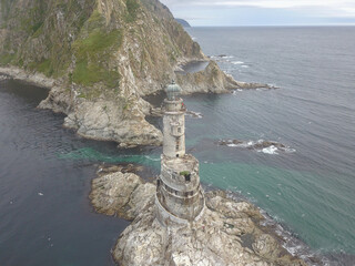 An old abandoned lighthouse from a close view.