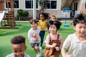 Energetic children joyfully running on a playground