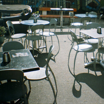 Empty Outdoor Cafe Tables Analog snapshots with a toy camera