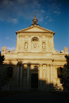 Historic university Facade in Paris with Warm Sunlight