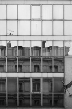 Reflections of Paris rooftops Architecture in Glass Windows