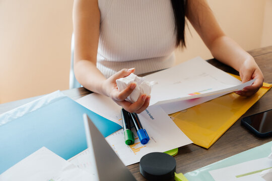 Office worker holding a ball of paper.