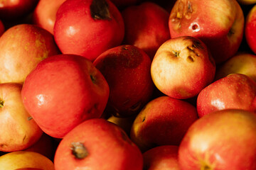 rotten red apples in a market