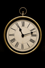 vintage clock isolated on black background