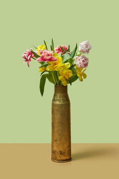 Spring tulips in upcycled artillery shell vase