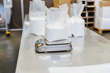 Close up of glucose in a plastic bag on a scale in a food processing facility