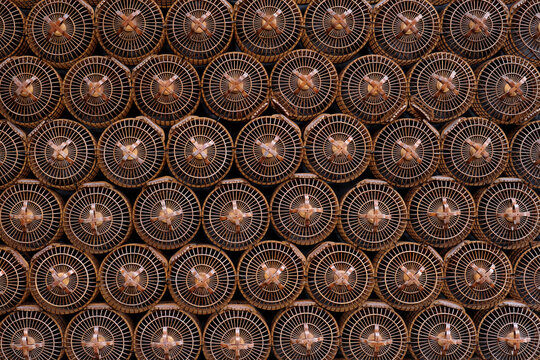 Closeup of a background wall made of wooden bird cages