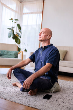 Retired man listening to meditation app