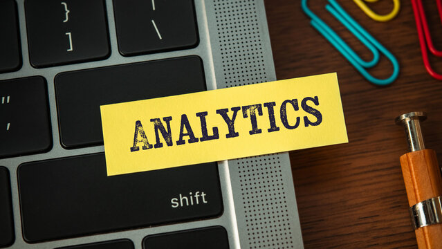 There is sticky note with the word Analytics. It is as an eye-catching image.