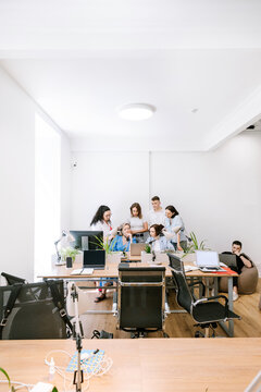 The team discusses a working draft in the office