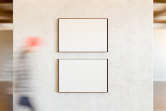 Double Frame Mockup with Blurred Gallery Visitor
