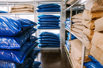 Storage area filled with blue bags of materials