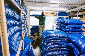 Sorting blue bags in a storage facility