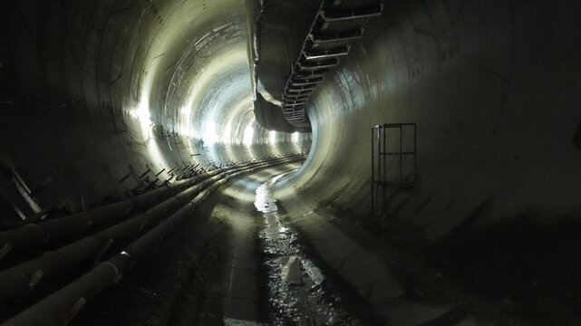 Dark Underground Tunnel With Curved Path and Steel Structures