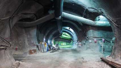 Industrial Underground Mining Shaft with Equipment and Power Lines

