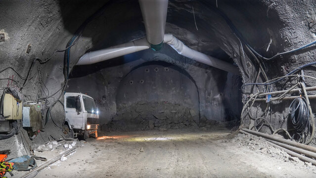 Truck Driving at Underground Tunnel Construction Site