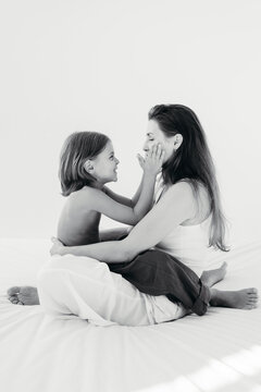 Heartwarming Moments Shared Between Mother and Child in Soft Light