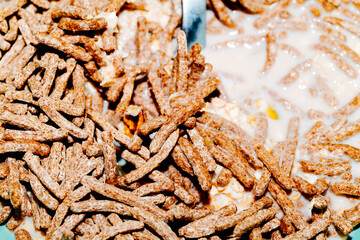 bran sticks in a bowl with oat milk 