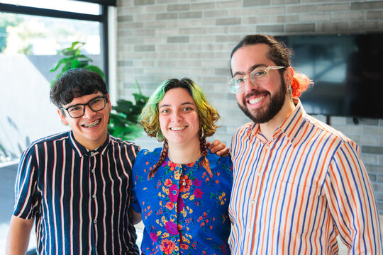 Colleagues smiling together in co-working space
