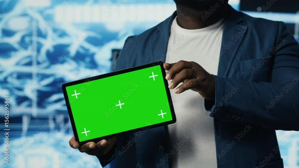Poster young technician holding a tablet with chroma key next to ai coding interfaces, promoting deep learn