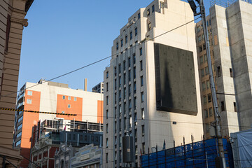 High-rise buildings and construction site backdrop