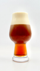 A closeup of a red Irish style ale isolated against a white background. 